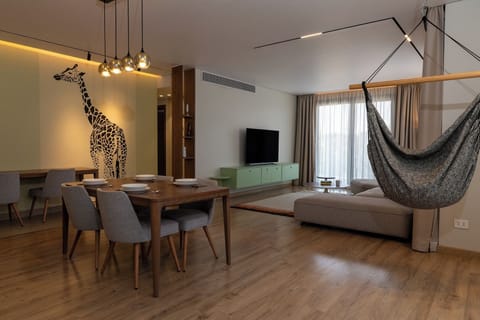 Apartment, Balcony, City View | Living area | Flat-screen TV