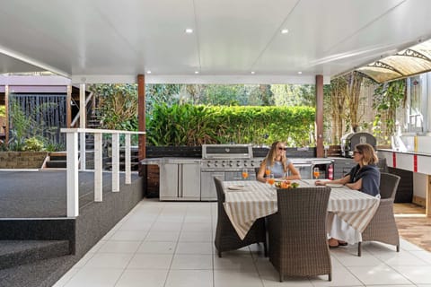Spend long afternoons in the expansive undercover entertaining area, where an outdoor dining table for eight, BBQ and ping pong table create the perfect setting for shared meals, relaxed catch-ups and friendly competition.