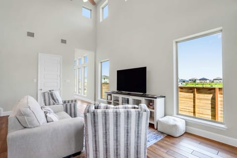 Curl up in the airy living room & stream your favorites on the smart TV