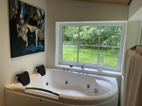 Deluxe Cottage, 1 King Bed, Accessible, Hot Tub | Bathroom | Shower, hair dryer, bathrobes, towels