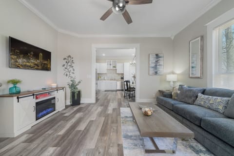 Open Living to Kitchen, Queen Sofa Sleeper, TV & LED Heated Electric Fireplace