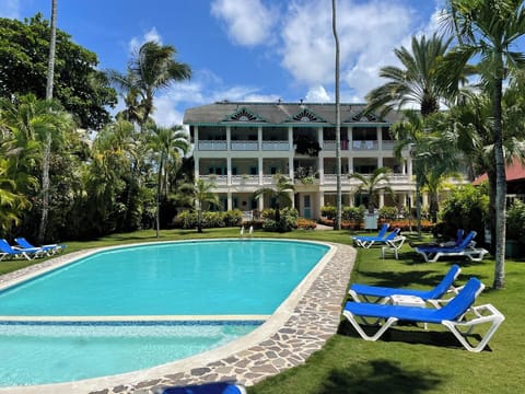 Large pool just steps away from the apartment surrounded by lush tropical greens