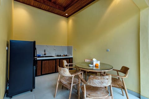 Deluxe Triple Room, Multiple Beds, Pool View | Private kitchen