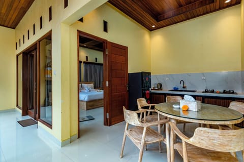 Deluxe Triple Room, Multiple Beds, Pool View | Private kitchen