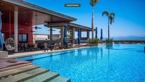 Experience resort-style living with a stunning infinity pool, panoramic mountain views, elegant lounge areas, and premium amenities designed for comfort, relaxation, and luxury.