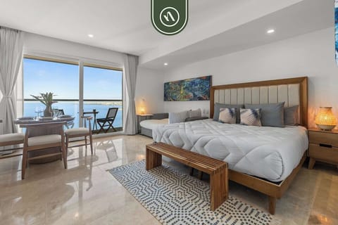 Bright ocean-view bedroom with modern décor and direct balcony access. Wake up to natural light, coastal breezes, and peaceful views for a relaxing stay.