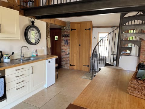 Kitchen and 'bridge' which connects upstairs bedroom and bathroom