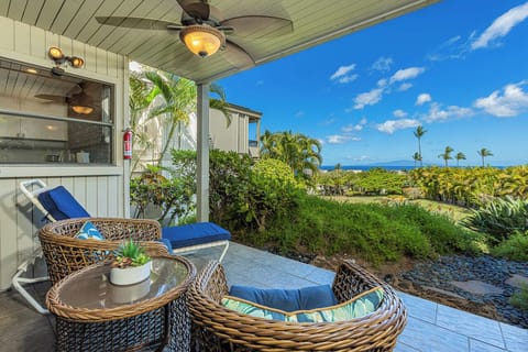 Sink into woven comfort on your private lanai, where tropical breezes mingle with ocean views stretching beyond lush gardens. Perfect for morning coffee or sunset cocktails in paradise.