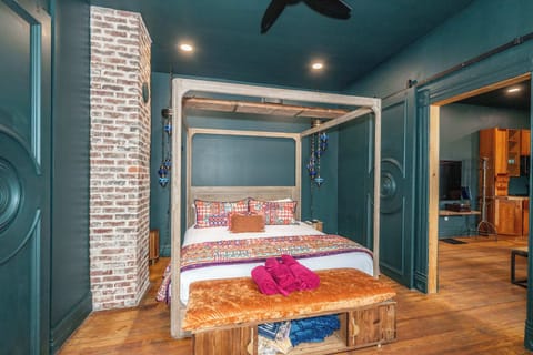 Eclectic king suite with ensuite bath & oversized screen for cozy movie nights