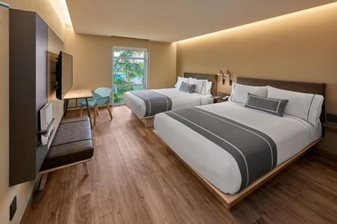 Unwind in a bright double-queen room with calming views.