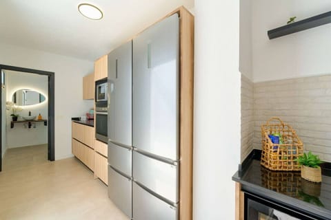 Double fridge, microwave and oven.