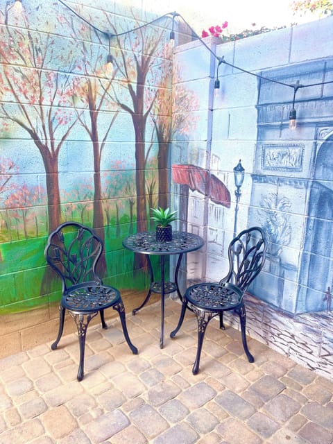 Morning coffee by Arc de Triomphe Mural