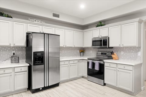 Whip up your favorite meals in this sparkling, fully stocked kitchen—where every detail says best day ever (and yes, the coffee's always waiting).