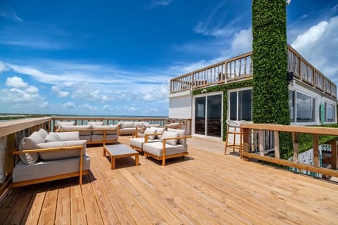 Unwind on the rooftop lounge with endless ocean views.