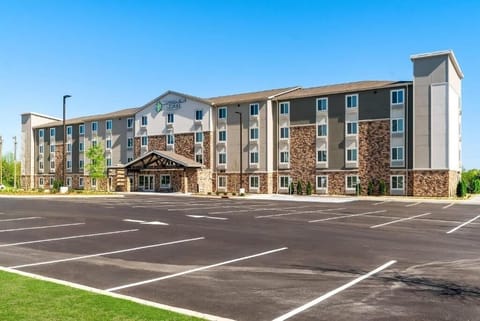 Arrive to a modern hotel exterior with easy parking access.