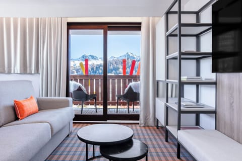 Comfort Apartment | Living area | 36-cm Smart TV with satellite channels, Netflix, streaming services