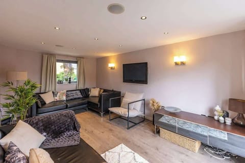 Plenty of space for everyone to gather — enjoy this roomy living room with two generous sofa seats.