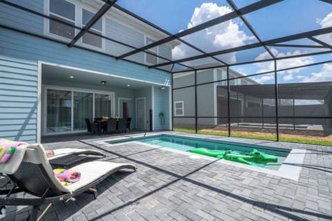Enjoy resort-style living with a private pool, sunny loungers, and shaded dining-perfect for relaxing or entertaining in the Florida sunshine!