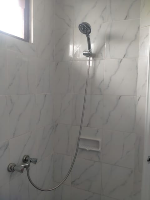 Shower, towels, soap, toilet paper