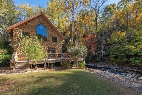 Stone Cottage may be right out of a fairytale, perfectly situated over beautiful Spring Creek in Hot Springs, NC