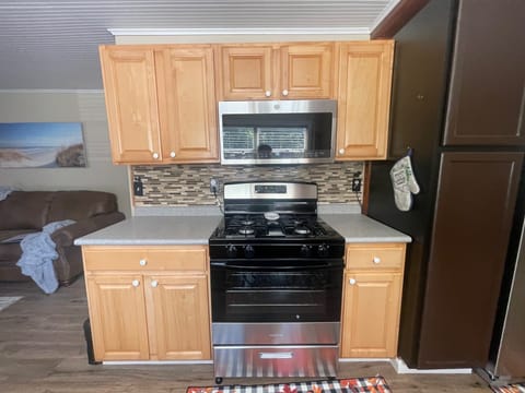 Kitchen stove, counters and cupboards 
