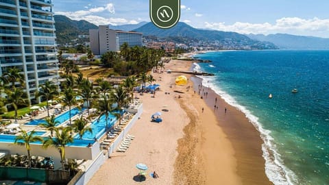 Experience stunning views of the coastline, beach, and surrounding area highlighting the unbeatable location and natural beauty just outside your stay.
