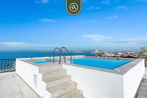 Climb the steps to pure relaxation! Our unique elevated rooftop pool and jacuzzi offer incredible, panoramic views of the city skyline and sparkling ocean.