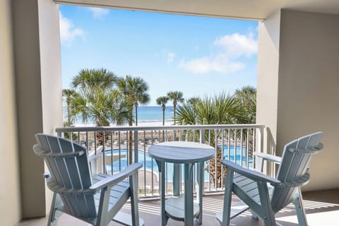 Sip your morning coffee on your private balcony while gazing at tropical palms and sparkling waters.