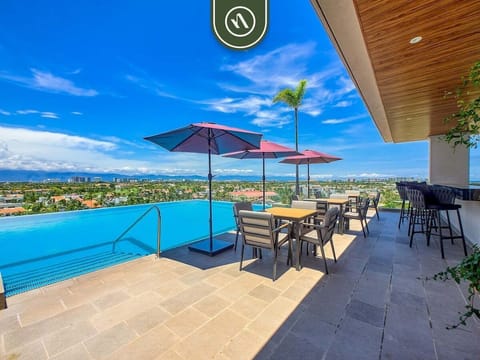 Experience resort-style living with a stunning infinity pool, panoramic mountain views, elegant lounge areas, and premium amenities designed for comfort, relaxation, and luxury.