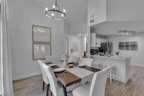 A seamless flow from kitchen to dining — table for six plus two barstools for extra seating.