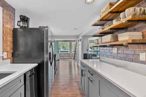 This fully stocked kitchen is ready for family meals and has plenty of space to move around!