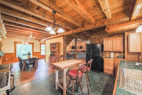 The kitchen features a spacious center island, perfect for presenting your next delicious meal, extra seating for casual chats, or keeping your partner company while they whip up something amazing!