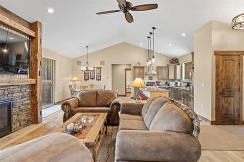 Relax in style—this sun-drenched living room features luxury furniture, soaring ceilings, and an airy mountain lodge feel