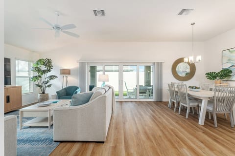 Open floor plan with shared living and dining, overlooking the gorgeous lanai