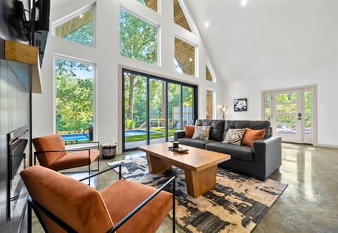 Bright, beautiful, and full of natural light. This living space feels fresh, cozy, and open.