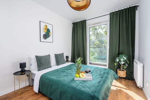 Comfort Apartment | Desk, blackout drapes, iron/ironing board, cribs/infant beds