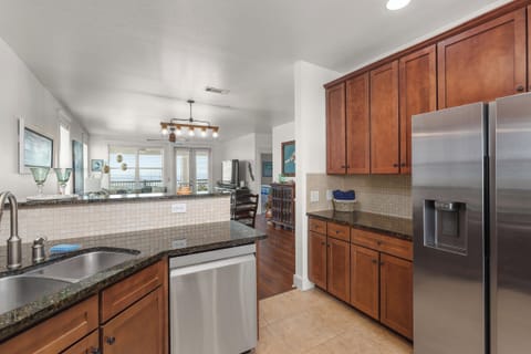 Fully equipped kitchen with stainless steel appliances.