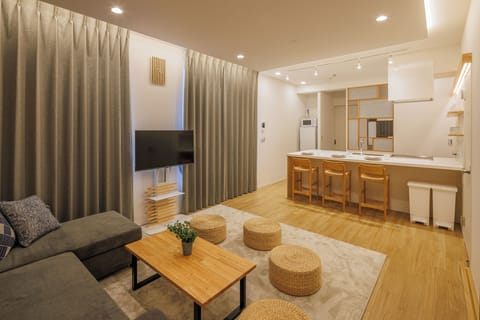 Premium Condo | Living area | 50-inch flat-screen TV with digital channels