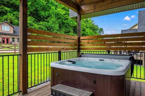 Slip into the bubbling hot tub for the ultimate relaxation, surrounded by the privacy of wood paneling and the serene backdrop of Smoky Mountain trees.
