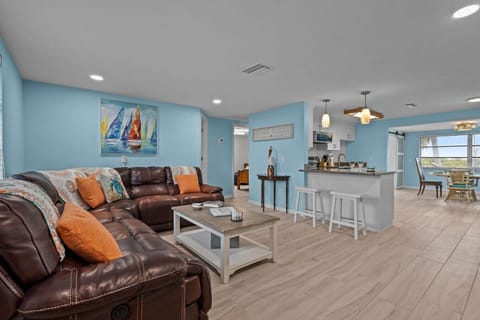 Open-concept living connects the comfy lounge area to the modern kitchen and dining, keeping everyone together.