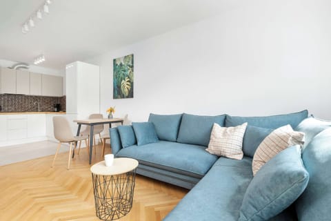 Stylish blue sofa – Chic, comfortable seating area.