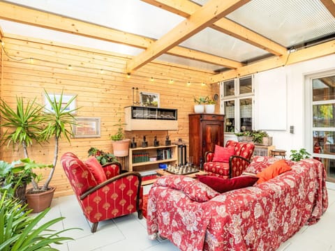 Furniture, Interior Design, Couch, Wood, Flooring, Floor, Living Room, Ceiling, Flowerpot, Table