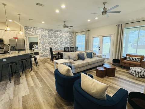Open-concept living, dining, and kitchen - perfect for gathering after a day on 