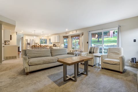 Alternate view of the living room highlighting the open concept and sliding doors to the backyard.