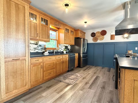 The kitchen cupboards and drawers are filled with all the necessities to cook meals right at the house! A large pantry is left open to make storing your groceries easy and accessible! 