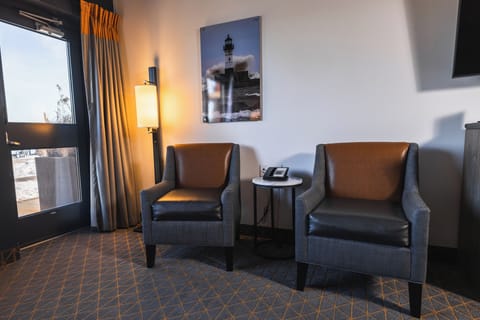 Premium bedding, desk, laptop workspace, iron/ironing board