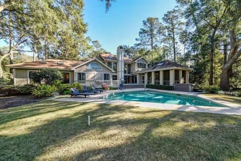 View from the golf course - pool and deck get plenty of sun! Also, walkable to tennis and pickleball!