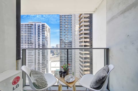 Enjoy city views from the balcony. (Chairs on balcony are from the dining area)