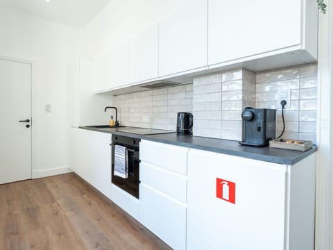 Flooring, Kitchen, Countertop, Wood, Cabinetry, Floor, Interior Design, Kitchen Appliance, Major Appliance, Cupboard