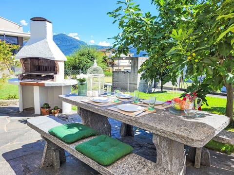 Furniture, Outdoor Furniture, Outdoor Table, Mountain Range, Garden, Landscaping, Shade, Chair, Alps, Flowerpot